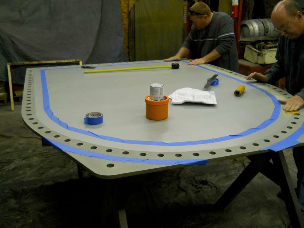 Planning and masking the door plate before coating.