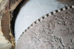 The same area after the first Belzona coat — pits filled and rivet detail sealed.