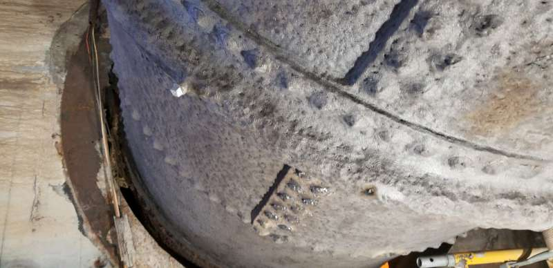 Before: heavy pitting and seam loss around the rivet lines where water tracked and sat.