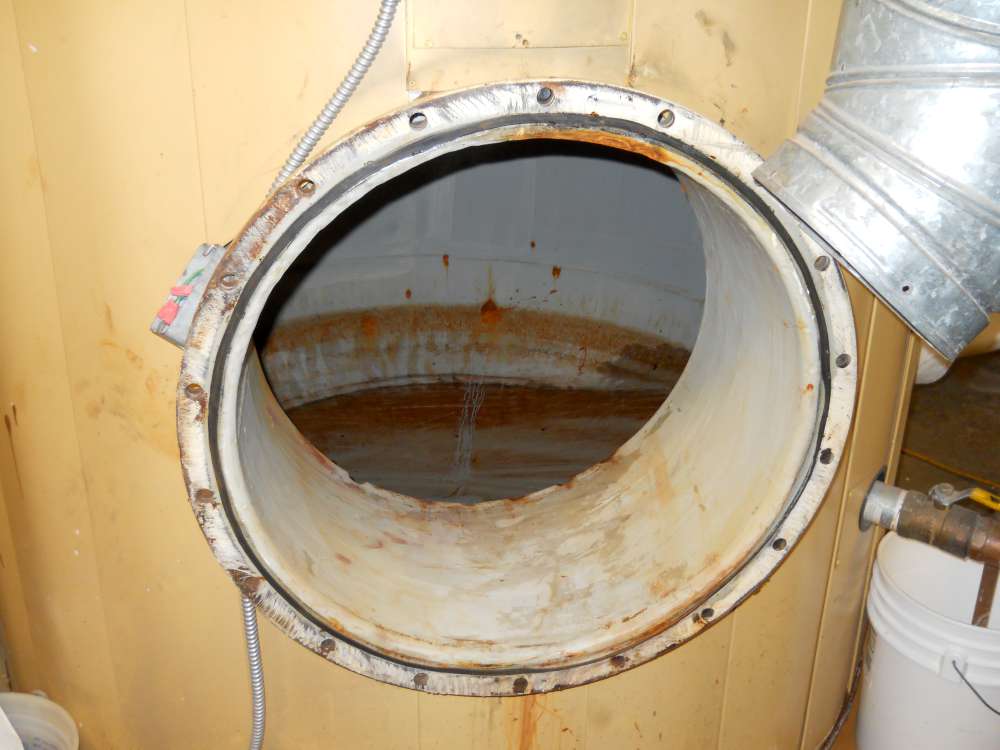 Before: the internal coating broken down and the steel beneath pitted.