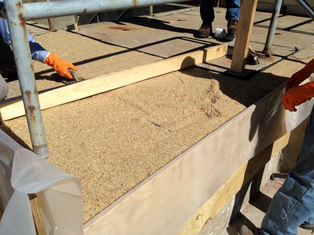 Wood supports set as formwork while Belzona 4154 and pea gravel are placed.