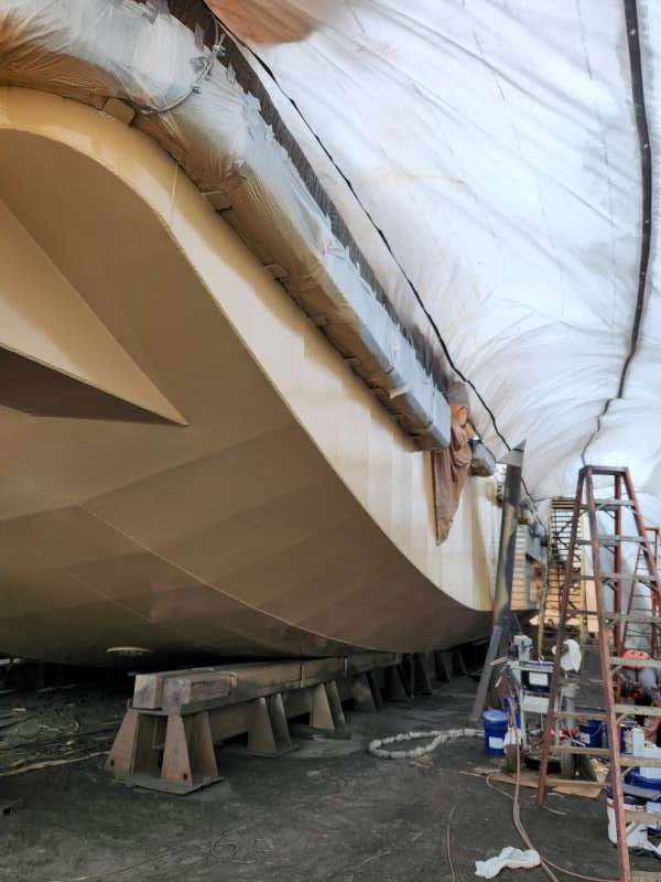 Base coat continuous around the chine and bow section.