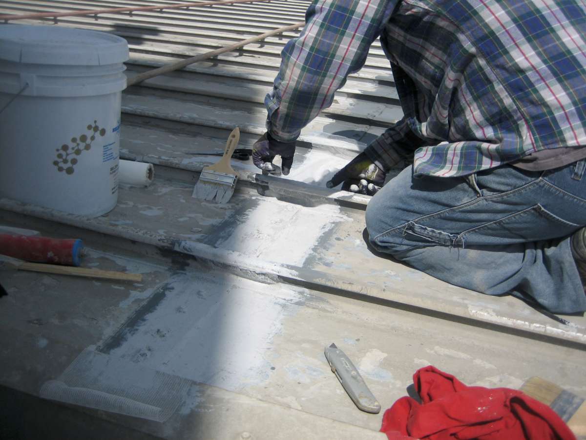 Application: Belzona 3111 brushed along a seam with reinforcement sheet embedded.
