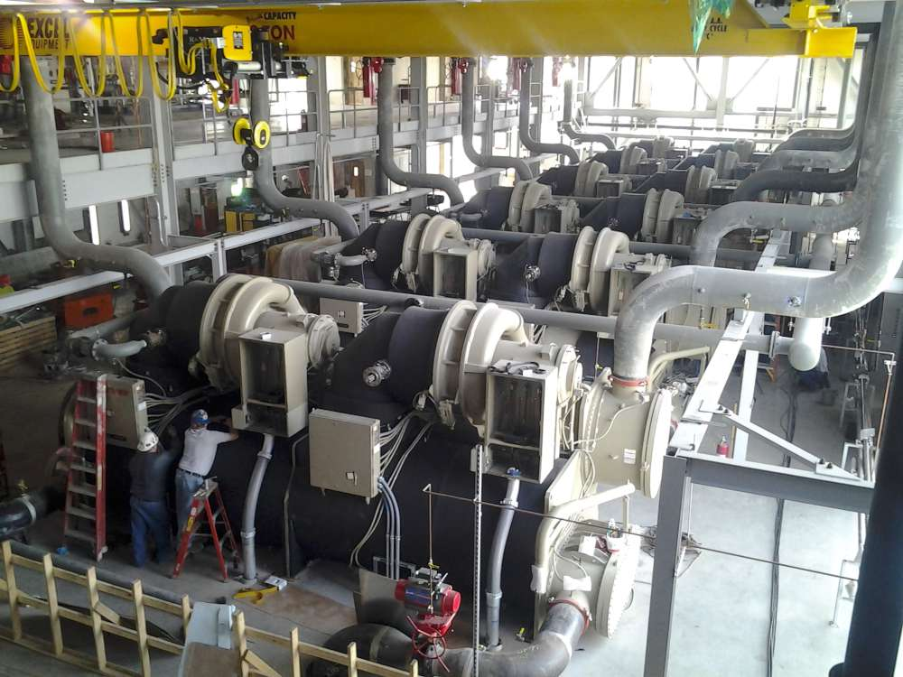 Plant overview: one of the two chiller buildings, each housing eight heat exchangers.