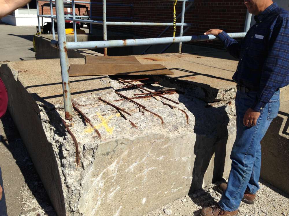 Before: years of wear had broken away the dock corner, exposing corroded rebar.