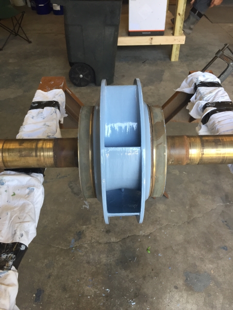 Impeller and shaft assembly coated ahead of reassembly.