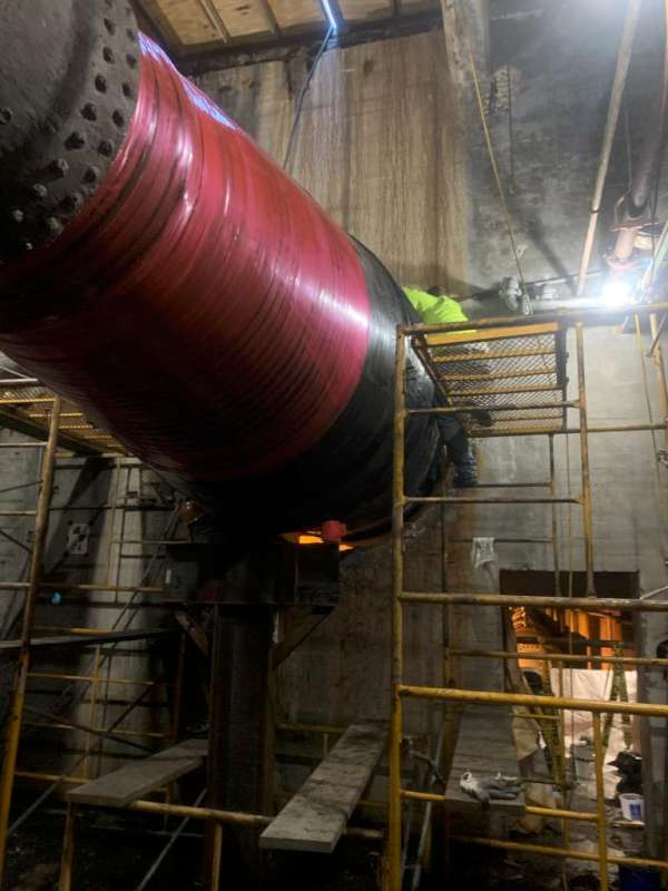Nearing completion: the rebuilt 20 ft run coated end to end and over-wrapped with SuperWrap.