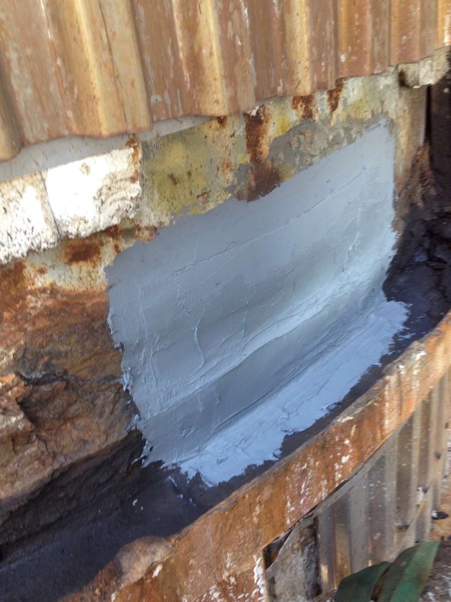 Leak area sealed with grey Belzona repair material