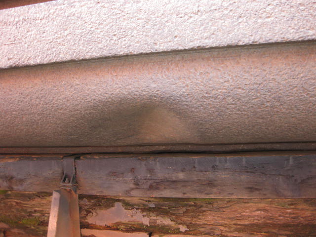 Prepared steel along a structural member ahead of coating.
