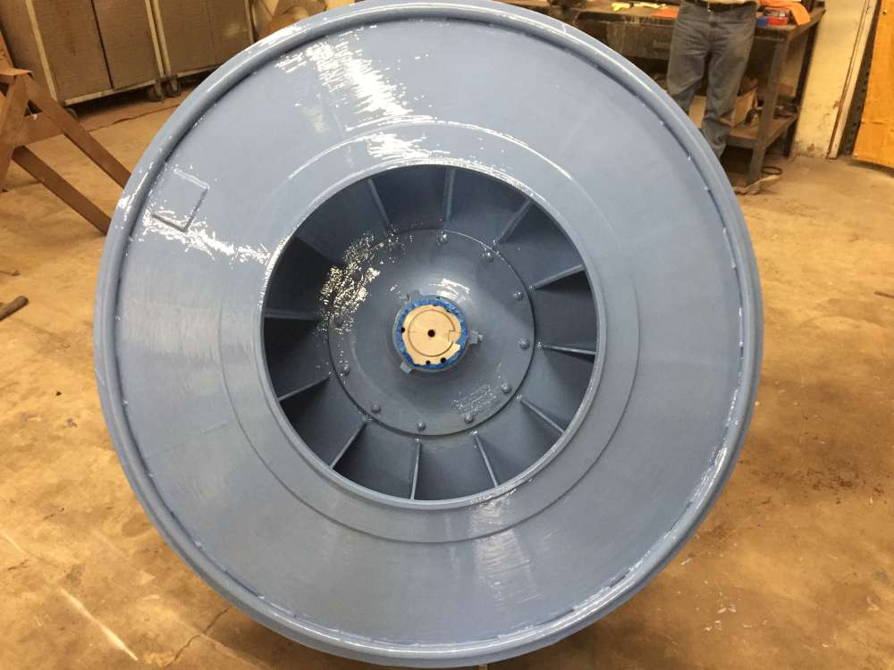 First coat: inlet side coated, showing full coverage through the blade passages and around the hub.