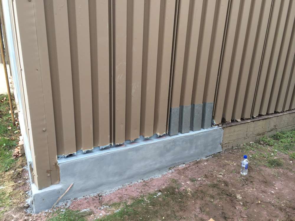 Deteriorated Wall & Concrete Base Rebuilt