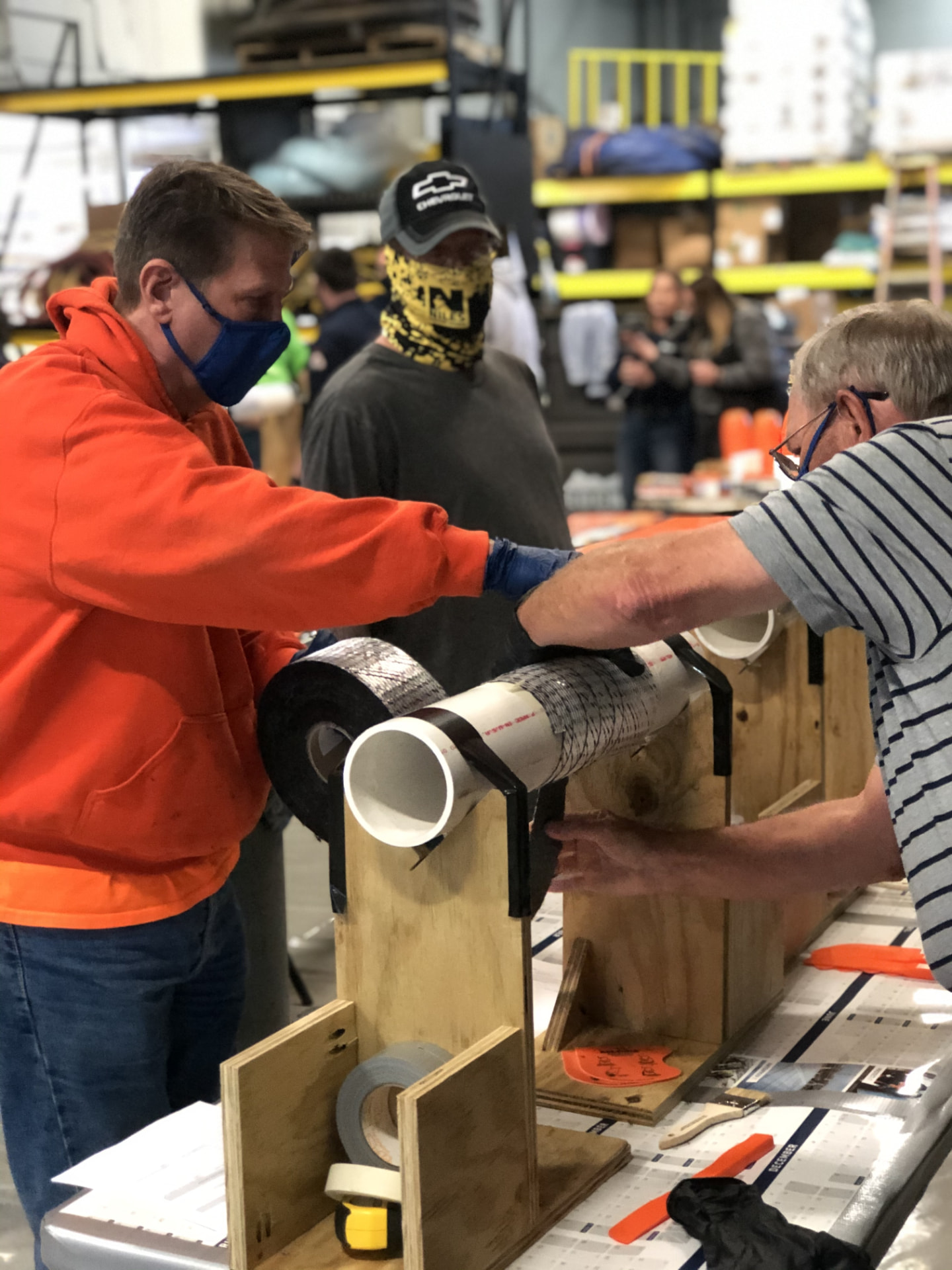 Instructor demonstrating a composite wrap repair on pipework