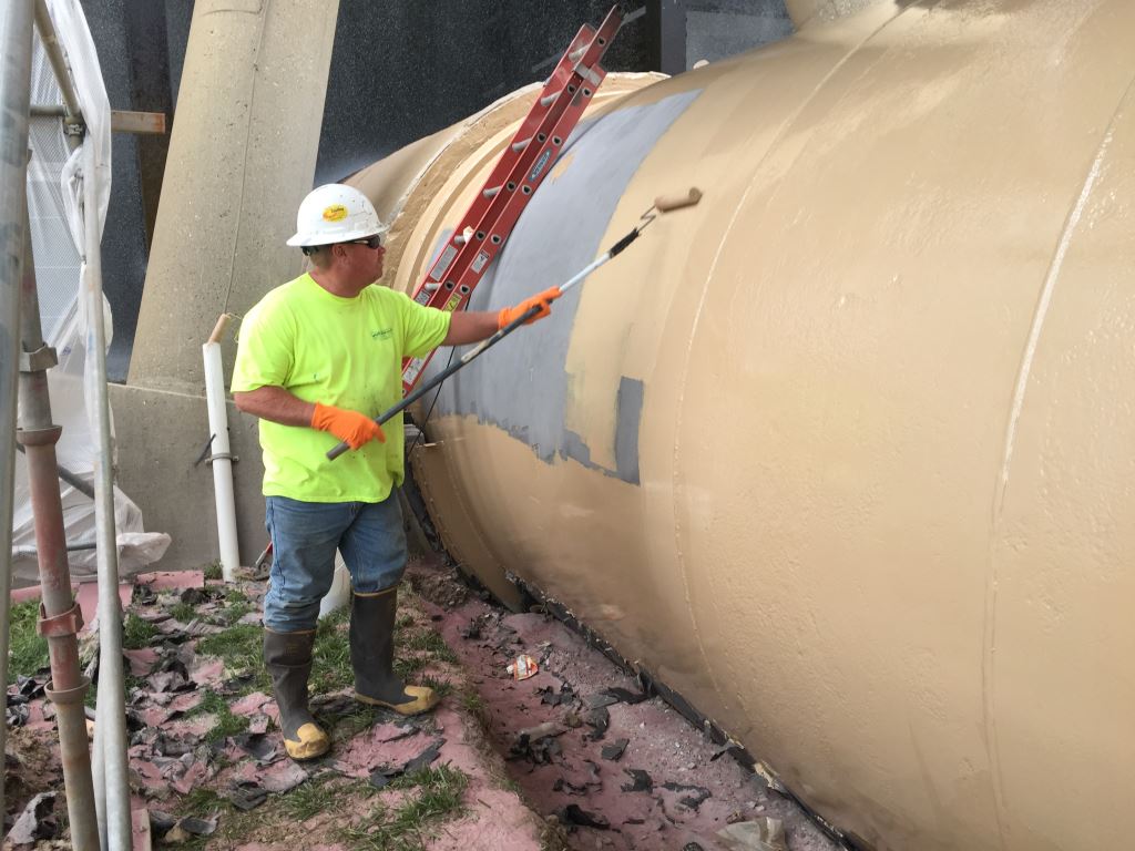 The same pipe being coated with Belzona