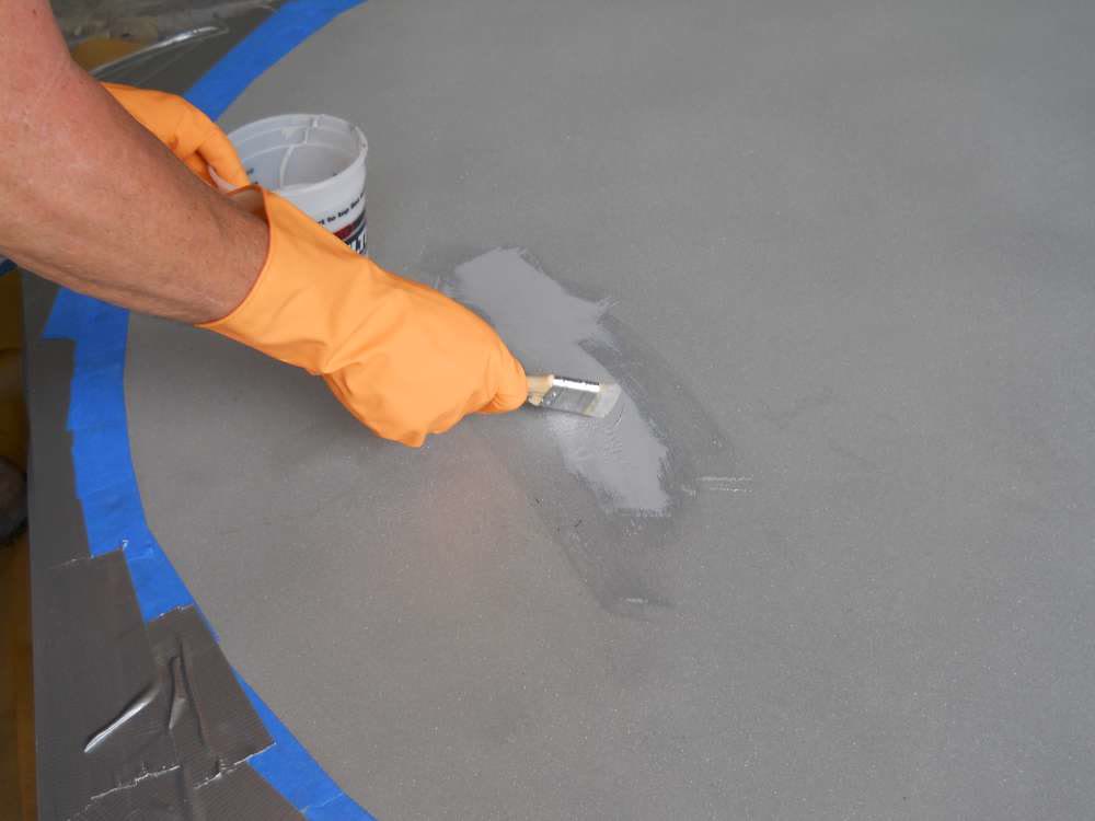 Belzona 1391 being applied to the door plate.