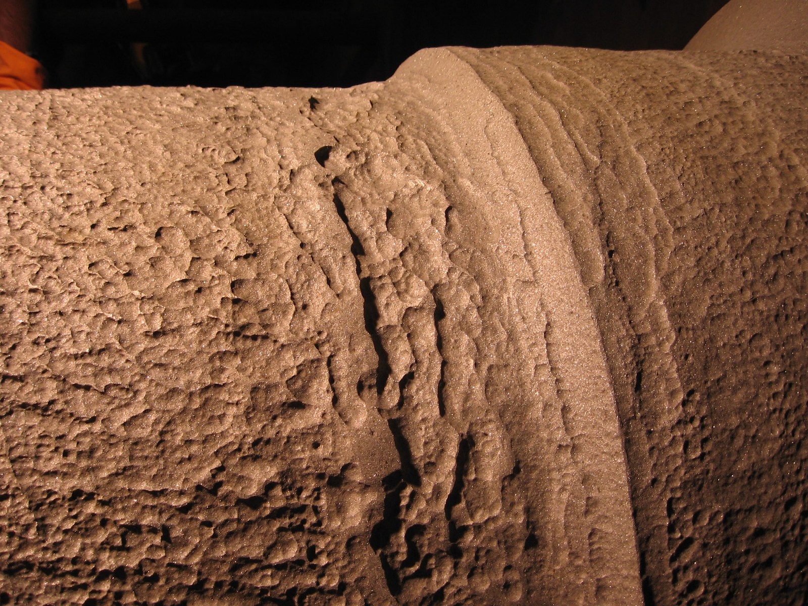 ID fan shaft with severe erosion damage before repair