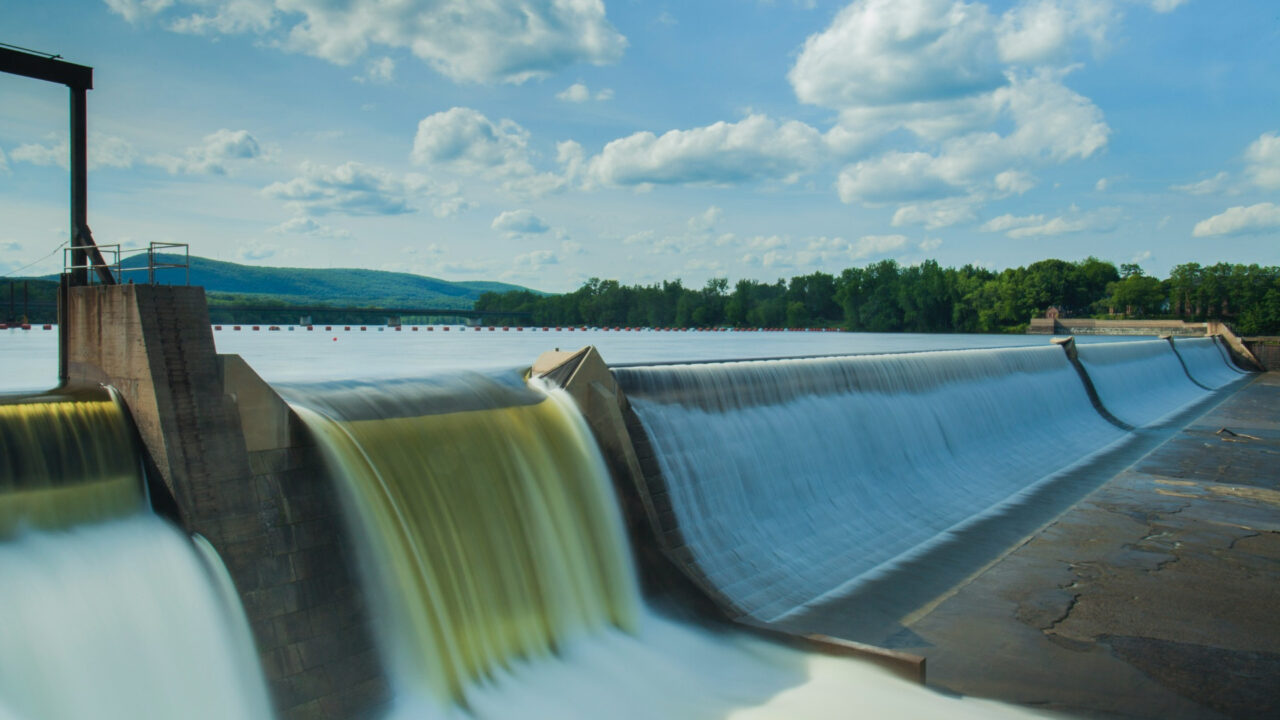 Water flowing over a hydroelectric dam spillway