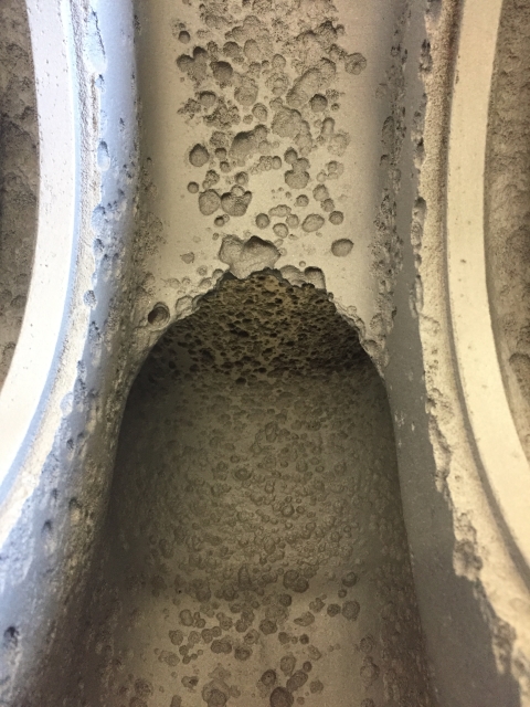 Before: close-up of erosion damage inside the waterway.