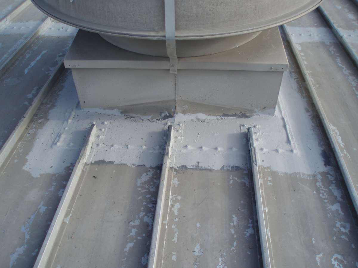 After: seams and fasteners around a roof vent sealed with Belzona 3111.